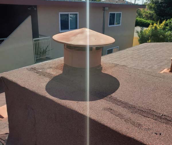 Astro Roofers in alameda installing a new roof  with a chimney
