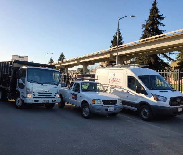 oakland-roofers astro roofing company trucks in oakland, ca