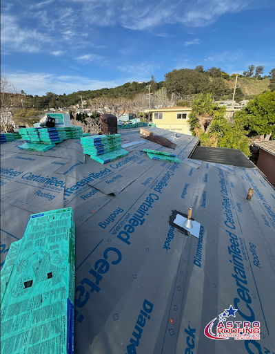 Roof with CertainTeed roofing underlayment and stacked shingles, with the One Way Roofing logo visible.<br />

