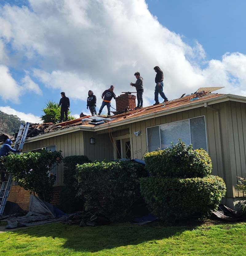 astro roofing team above ont he roof